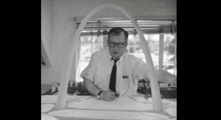 Saarinen with a model of his Gateway Arch