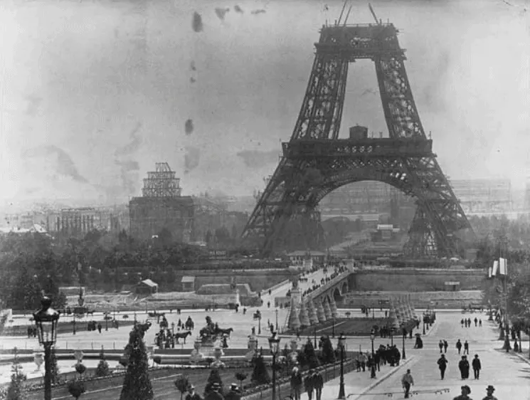 The Eiffel tower along with numerous other buildings under construction